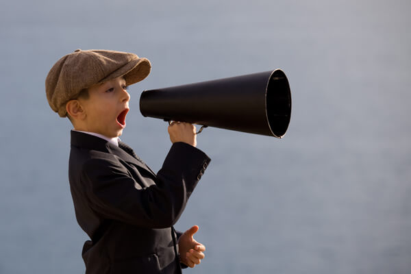 young boy holding a megaphone