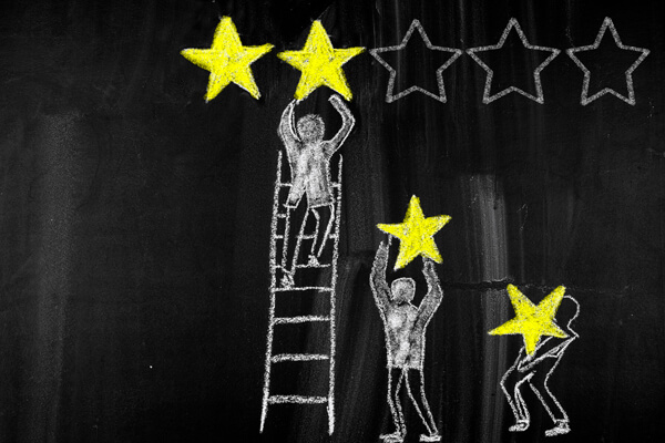 chalk drawings of people lifting chalk drawings of stars in the style of a 5 star rating