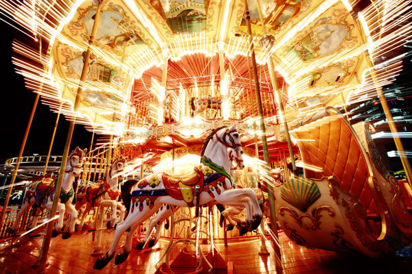 bright, lit merry go round at night