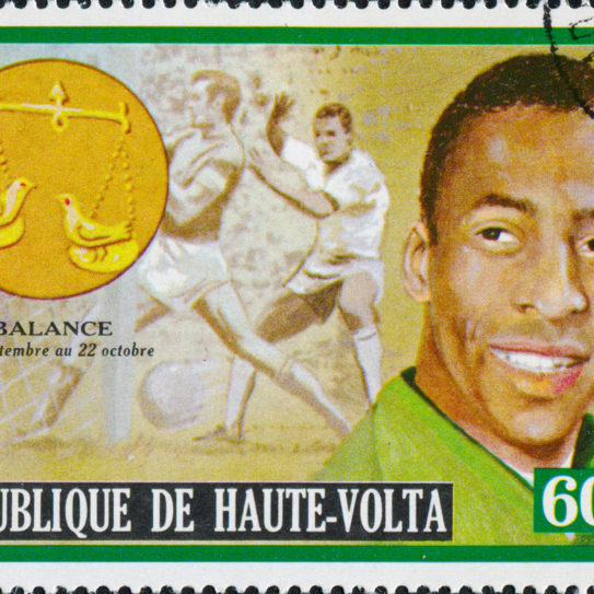 a postage stamp featuring the soccer legend, Pele