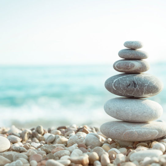 a pile of circular stones that symbolize a foundation