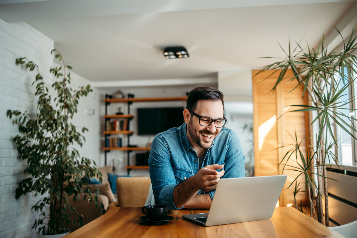 young entrepreneur uses his laptop