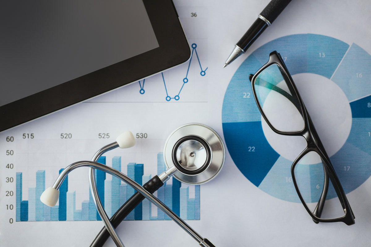 stethoscope, tablet, pen, and glasses