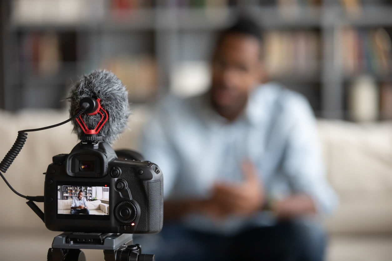 A man recording himself.