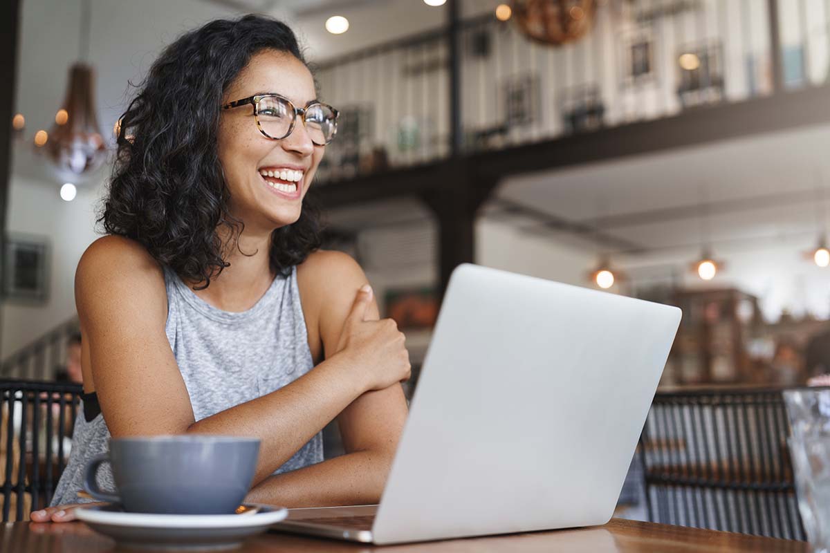 happy woman using laptop