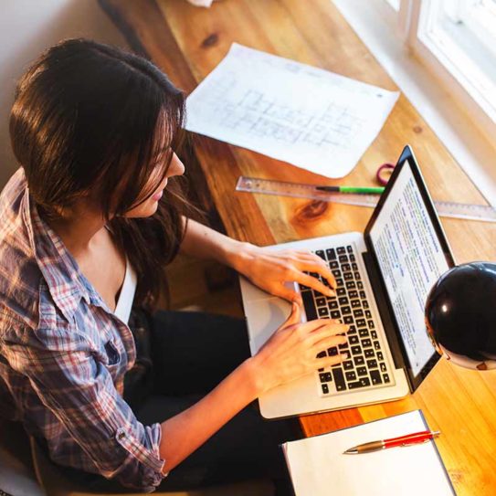 Young female blogger working at home