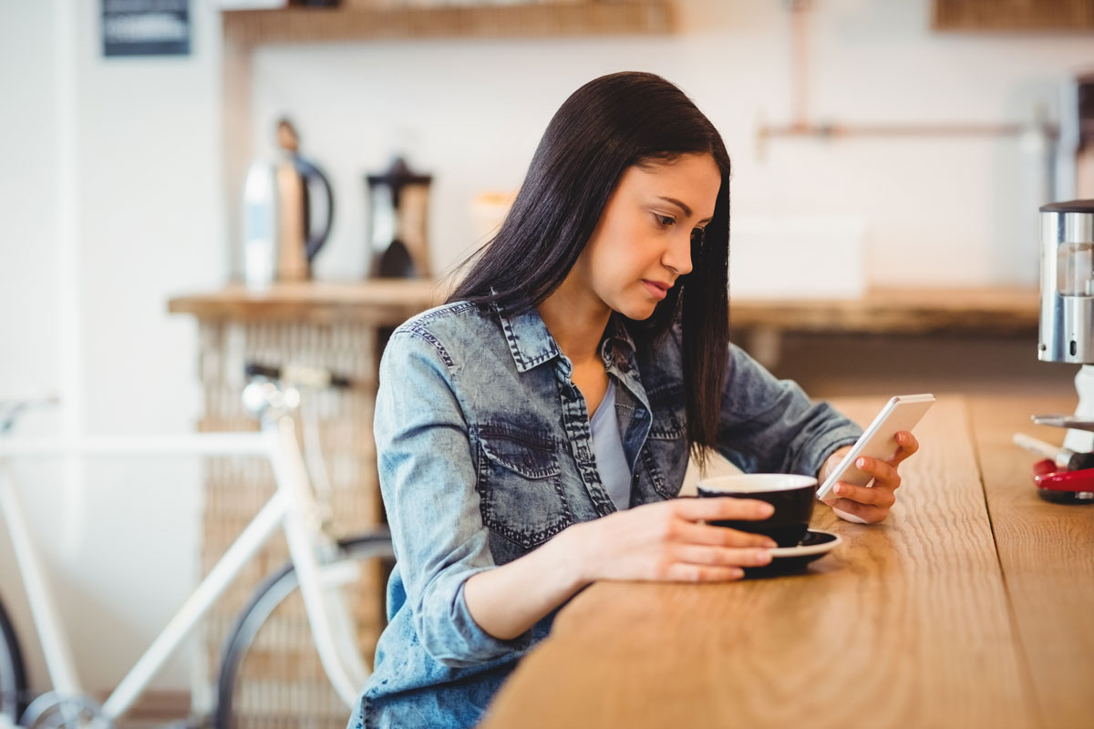 female business owner with a cup of coffee