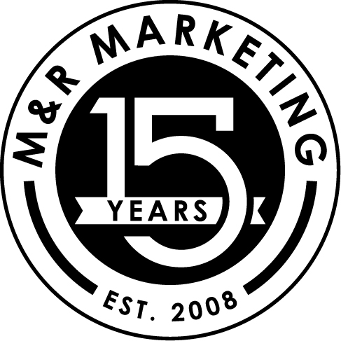 The M&R Marketing 15 Year Anniversary Logo: A white circle imprinted with the words “M&R Marketing – Est. 2008” surrounding a smaller black circle containing a large number reading “15 Years”
