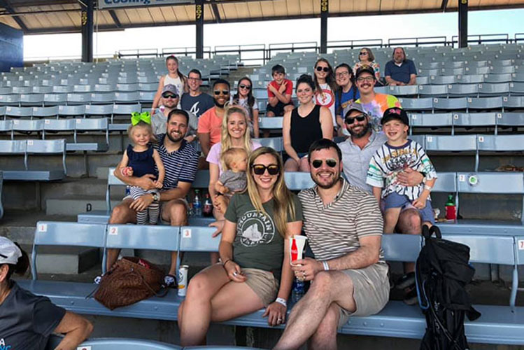 M&R Marketing team enjoying watching a baseball game