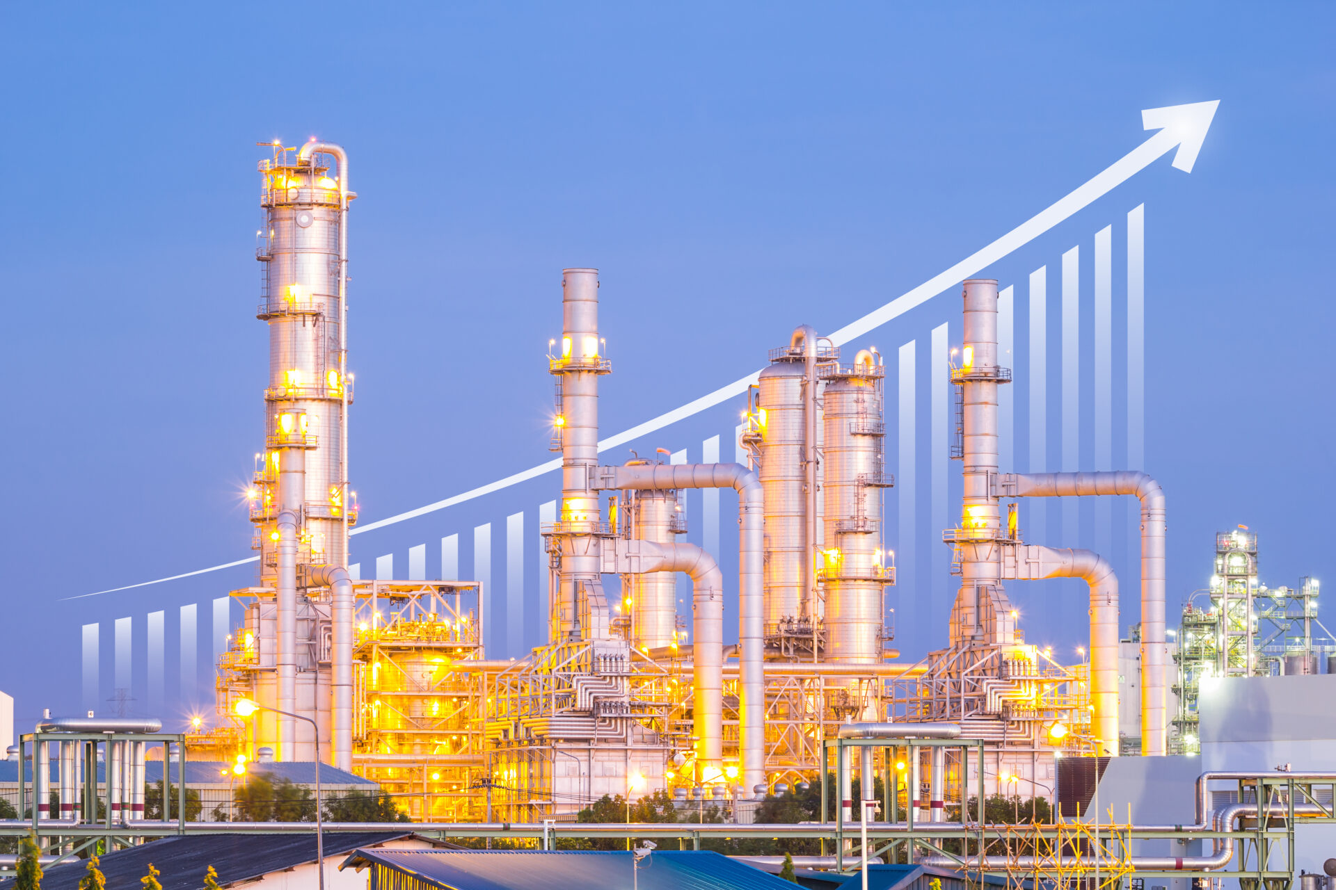 Oil refinery at twilight with sky background.