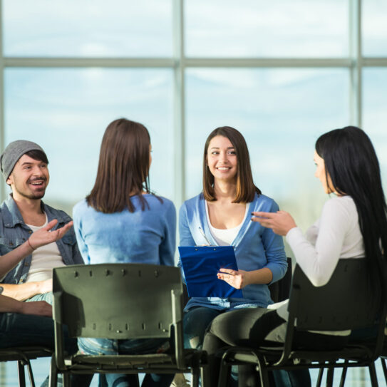 Circle of trust. Group of people are sitting in circle and supporting each other.