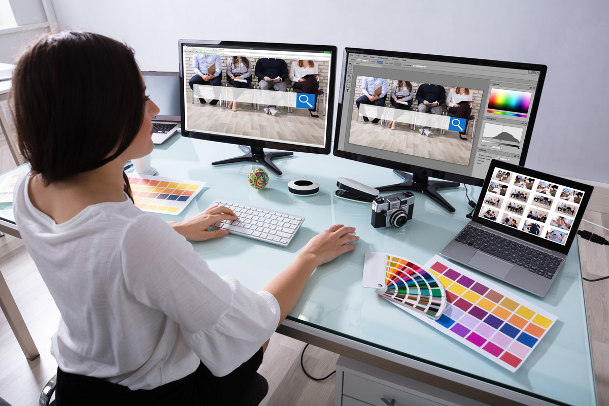 a graphic designer works on her computer