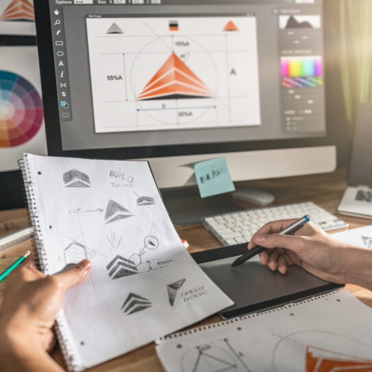 Graphic designer drawing sketches logo design. The concept of a new brand. Professional creative occupation with idea.