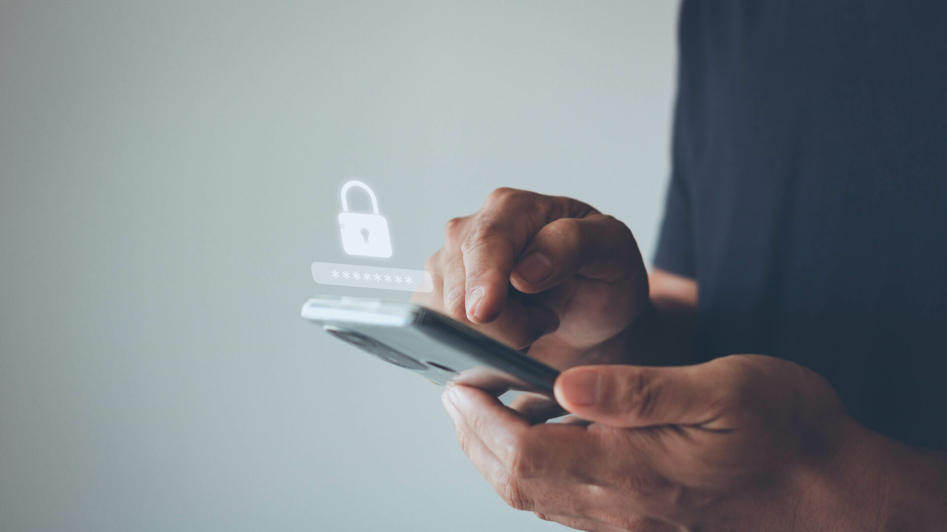 A person holds and uses a smartphone with a digital lock icon and password field overlayed symbolizing mobile security data protection or secure login The background is plain and blurred.
