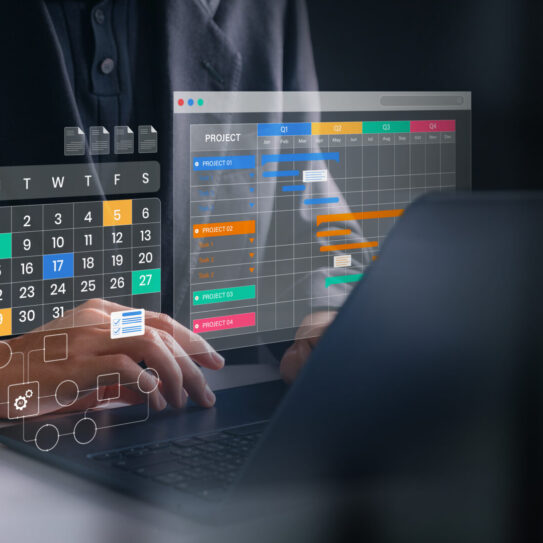 Person using a laptop with digital overlays of a calendar, task list, and charts, representing modern scheduling and productivity tools.